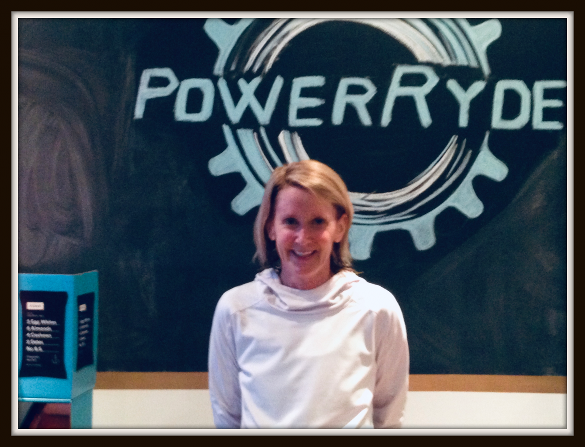 Katy Lonneman in front of PowerRyde logo